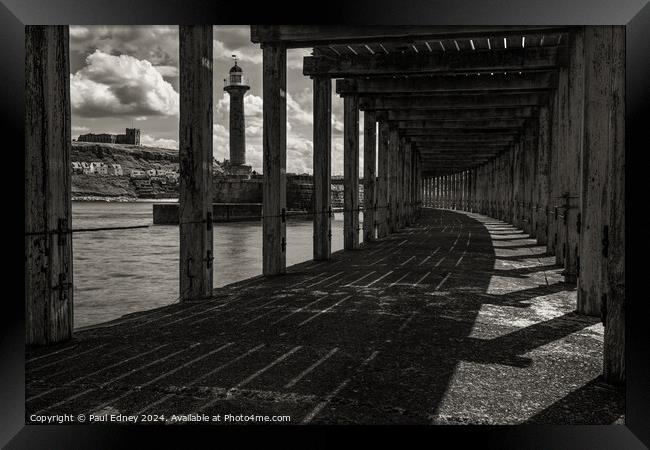 Under Whitby West pier monochrome Framed Print by Paul Edney