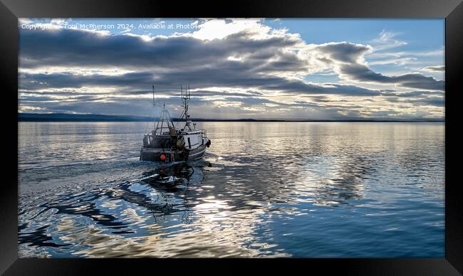 Lone fishing boat Framed Print by Tom McPherson