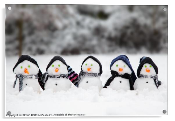 Cute little snowmen dressed in hats and scarfs in snow Acrylic by Simon Bratt LRPS