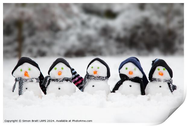 Cute little snowmen dressed in hats and scarfs in snow Print by Simon Bratt LRPS