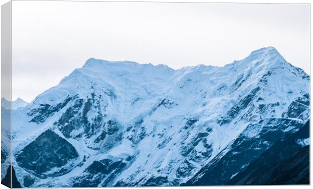 snow covered mountain range Canvas Print by Ambir Tolang