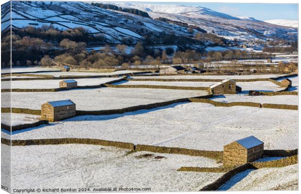 The Barns at Gunnerside in Swaledale on a bright, snowy winter's Canvas Print by Richard Burdon