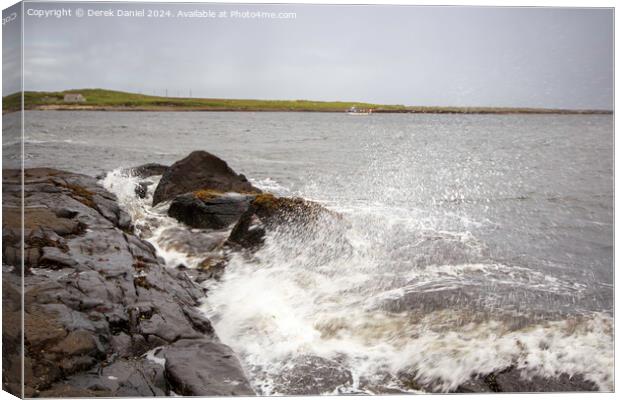 Waves crashing into the rocks at Staffin Bay Canvas Print by Derek Daniel