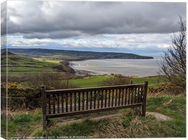 Bench with a view of Robin Hoods Bay Canvas Print by Angela Wallace