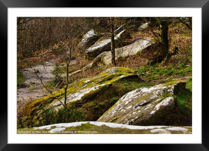 Moss-covered rocks in a forest with sunlight filtering through trees at Brimham Rocks, in North Yorkshire Framed Mounted Print by Man And Life