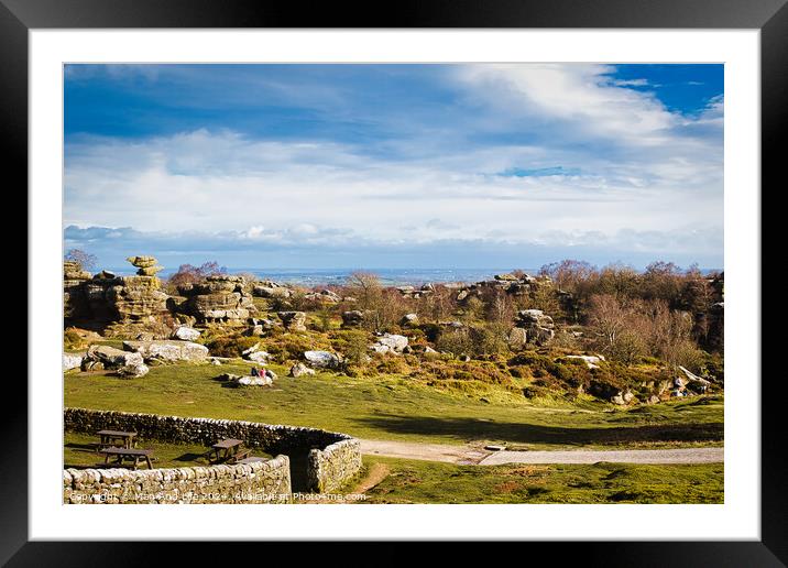 Scenic landscape with rocky formations, greenery, and a clear sky, ideal for travel and nature themes at Brimham Rocks, in North Yorkshire Framed Mounted Print by Man And Life