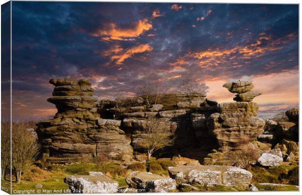 Dramatic sky at sunset over rugged rock formations in a serene landscape at Brimham Rocks, in North Yorkshire Canvas Print by Man And Life