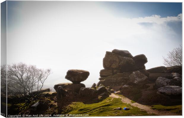 Misty landscape with balancing rock formations and a clear path under a bright sky at Brimham Rocks, in North Yorkshire Canvas Print by Man And Life
