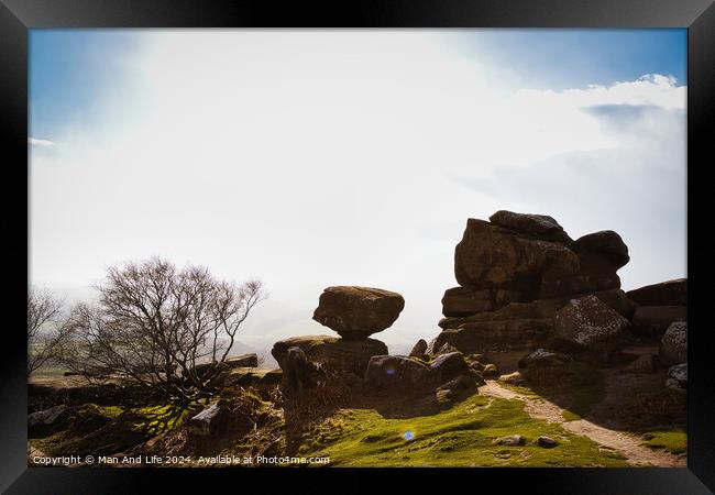 Sunny landscape with silhouetted rock formations and a clear sky at Brimham Rocks, in North Yorkshire Framed Print by Man And Life