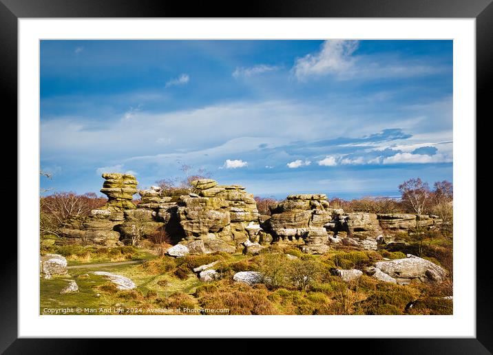 Picturesque rocky landscape with unique rock formations under a blue sky with fluffy clouds at Brimham Rocks, in North Yorkshire Framed Mounted Print by Man And Life