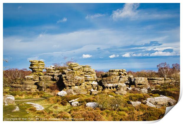 Picturesque rocky landscape with unique rock formations under a blue sky with fluffy clouds at Brimham Rocks, in North Yorkshire Print by Man And Life