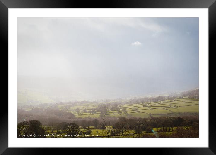 Misty countryside landscape with sunlit fields and scattered trees under a hazy sky at Brimham Rocks, in North Yorkshire Framed Mounted Print by Man And Life