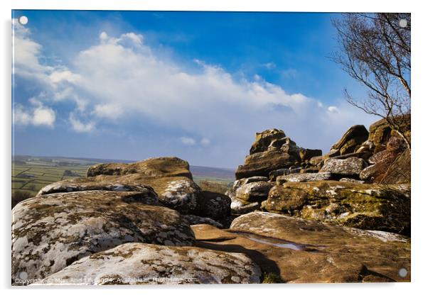 Scenic view of rugged rocks against a blue sky with fluffy clouds, highlighting the natural beauty of a mountainous landscape at Brimham Rocks, in North Yorkshire Acrylic by Man And Life