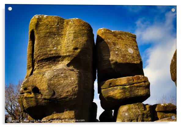 Majestic rock formations against a blue sky with clouds, showcasing natural erosion and geological textures at Brimham Rocks, in North Yorkshire Acrylic by Man And Life
