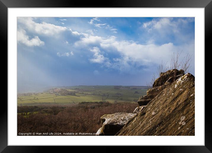 Scenic view from a rocky outcrop overlooking a lush valley under a dramatic cloudy sky at Brimham Rocks, in North Yorkshire Framed Mounted Print by Man And Life