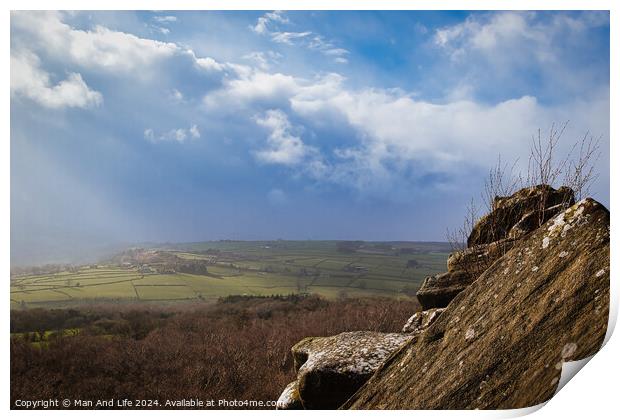 Scenic view from a rocky outcrop overlooking a lush valley under a dramatic cloudy sky at Brimham Rocks, in North Yorkshire Print by Man And Life
