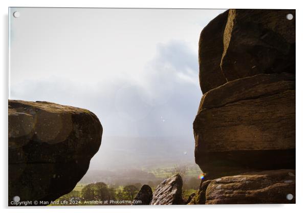 Scenic view of a landscape through rock formations under a cloudy sky at Brimham Rocks, in North Yorkshire Acrylic by Man And Life