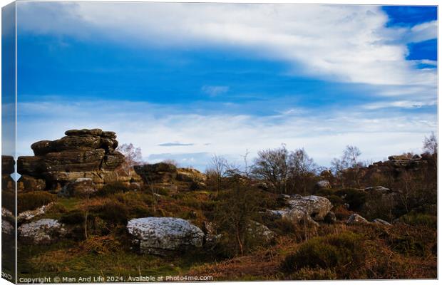 Scenic view of rock formations under a dramatic blue sky with clouds at Brimham Rocks, in North Yorkshire Canvas Print by Man And Life