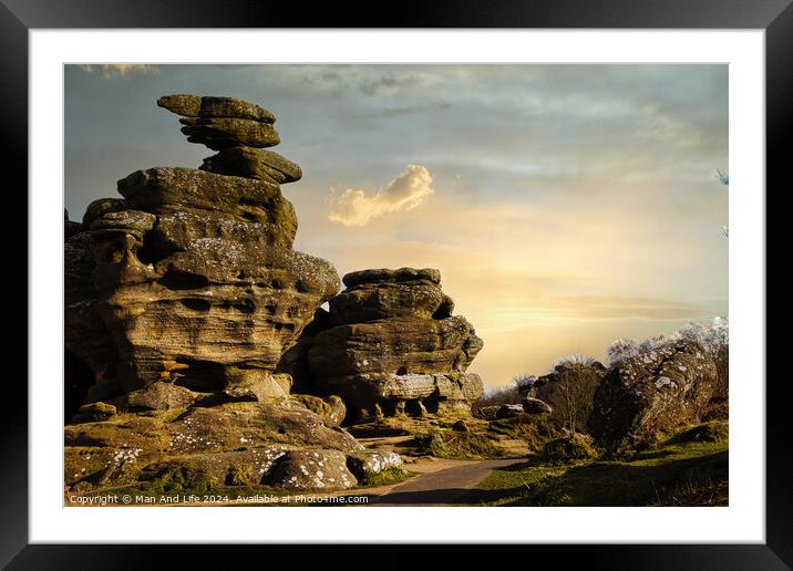 Scenic view of unique rock formations under a golden sunset sky with lush greenery in the foreground at Brimham Rocks, in North Yorkshire Framed Mounted Print by Man And Life