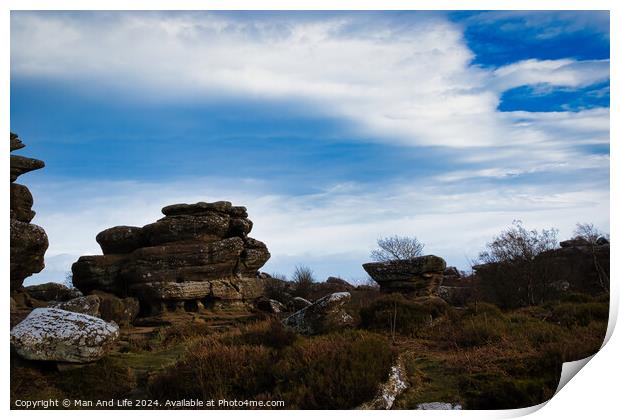 Scenic view of rugged rock formations amidst wild heath under a cloudy sky at Brimham Rocks, in North Yorkshire Print by Man And Life