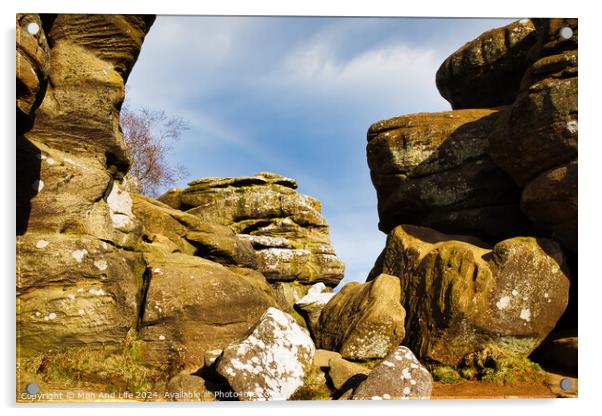 Scenic view of weathered rock formations under a blue sky with clouds at Brimham Rocks, in North Yorkshire Acrylic by Man And Life