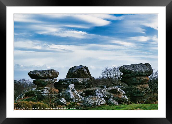 Scenic view of unique rock formations with moss under a cloudy sky in a lush green landscape at Brimham Rocks, in North Yorkshire Framed Mounted Print by Man And Life