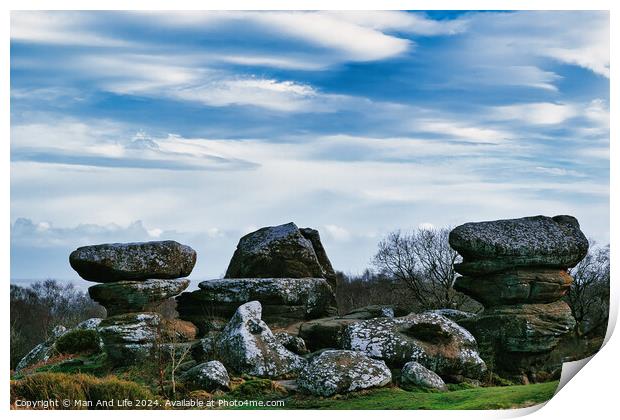Scenic view of unique rock formations with moss under a cloudy sky in a lush green landscape at Brimham Rocks, in North Yorkshire Print by Man And Life