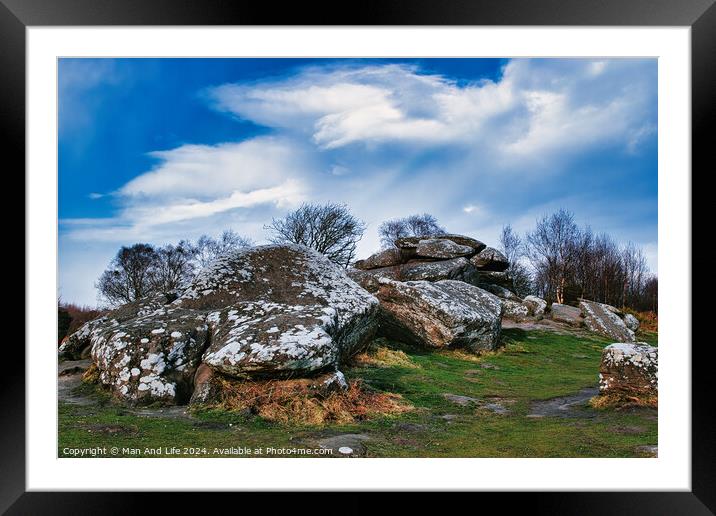 Rugged landscape with moss-covered rocks under a cloudy sky at Brimham Rocks, in North Yorkshire Framed Mounted Print by Man And Life