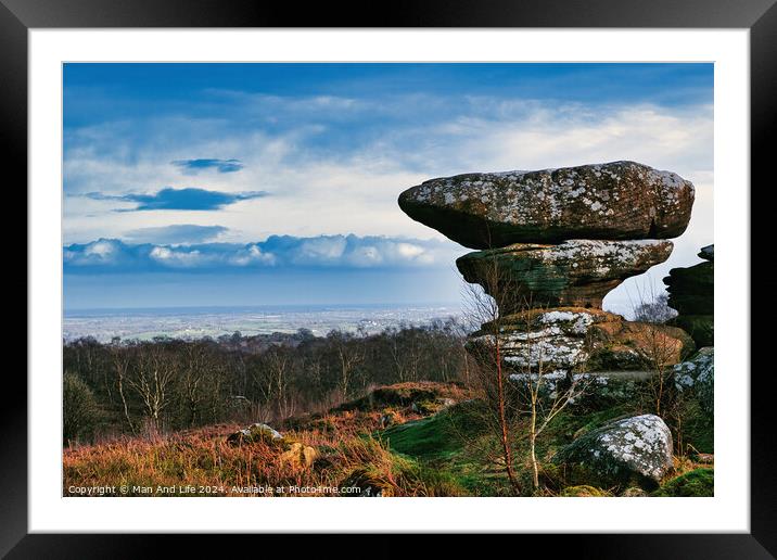 Scenic view of a unique rock formation in a lush landscape with dramatic clouds in the sky at Brimham Rocks, in North Yorkshire Framed Mounted Print by Man And Life