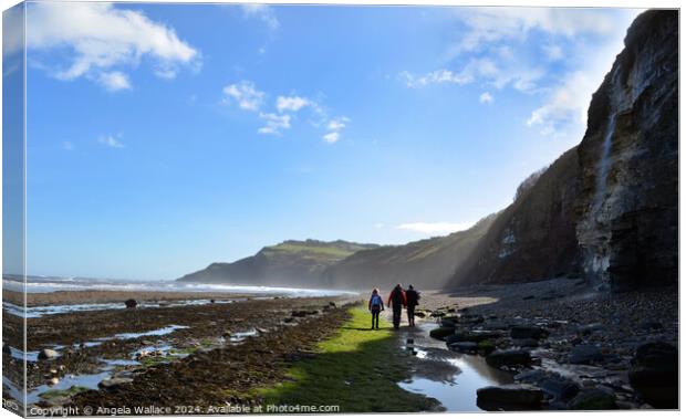 Walking on the beach at Robin Hoods Bay Canvas Print by Angela Wallace