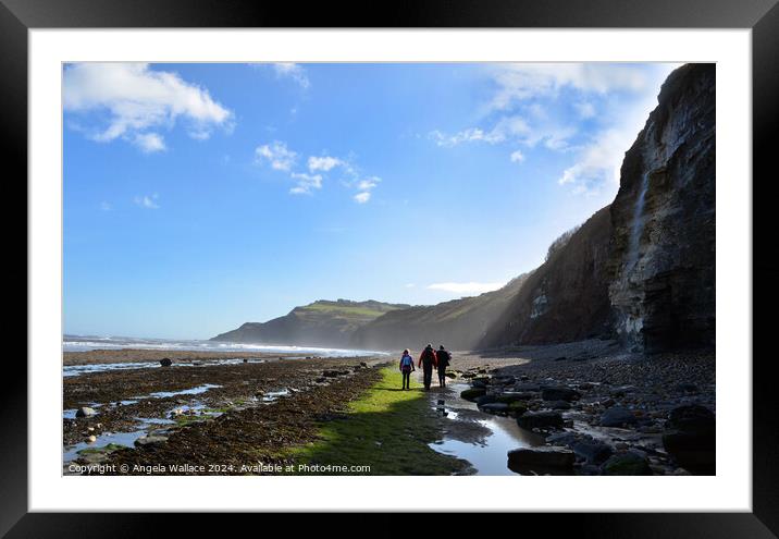 Walking on the beach at Robin Hoods Bay Framed Mounted Print by Angela Wallace