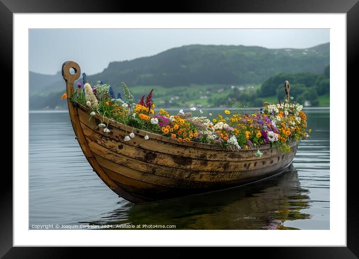 A viking boat filled with colorful flowers gently glides on the calm lake waters. Framed Mounted Print by Joaquin Corbalan