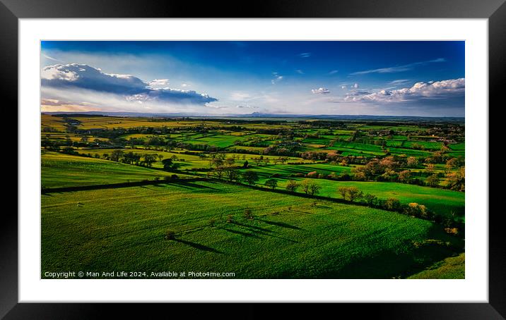 Aerial view of lush green countryside with fields and shadows cast by clouds, showcasing rural beauty in North Yorkshire. Framed Mounted Print by Man And Life