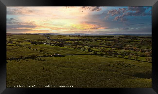 Aerial view of a lush green countryside under a dramatic sunset sky in North Yorkshire. Framed Print by Man And Life