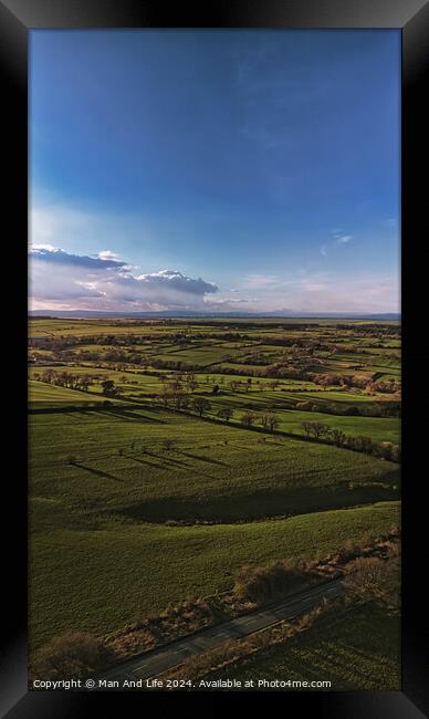 Scenic aerial view of lush green fields under a dramatic sky at dusk, showcasing the beauty of rural landscapes in North Yorkshire. Framed Print by Man And Life