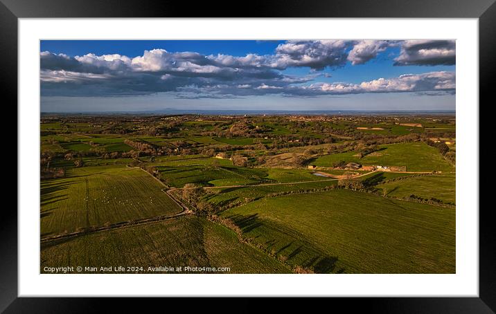 Scenic aerial view of lush green countryside with fields, trees, and a clear sky, showcasing rural beauty and agricultural landscapes in North Yorkshire. Framed Mounted Print by Man And Life