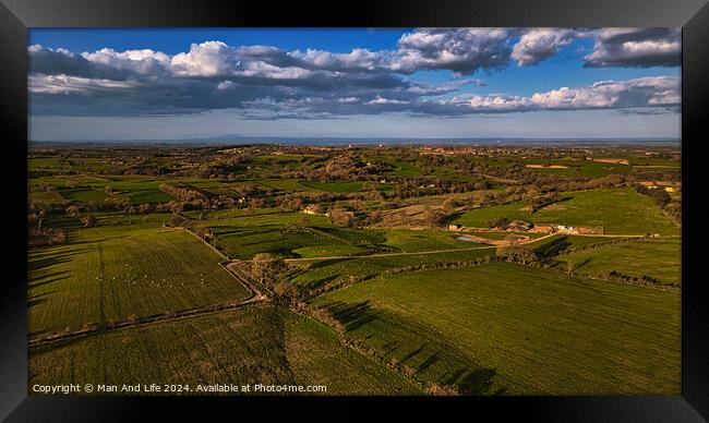 Scenic aerial view of lush green countryside with fields, trees, and a clear sky, showcasing rural beauty and agricultural landscapes in North Yorkshire. Framed Print by Man And Life