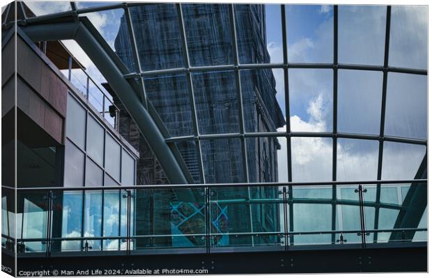 Modern glass building facade with reflections of clouds, showcasing contemporary architecture and design in Leeds, UK. Canvas Print by Man And Life