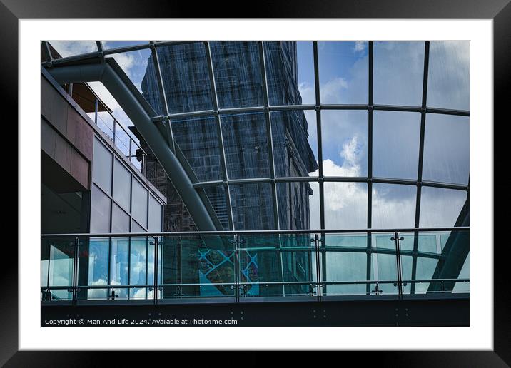 Modern glass building facade with reflections of clouds, showcasing contemporary architecture and design in Leeds, UK. Framed Mounted Print by Man And Life