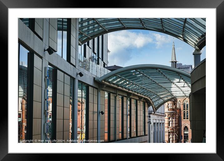 Modern glass-covered walkway with urban architecture and blue sky in the background in Leeds, UK. Framed Mounted Print by Man And Life