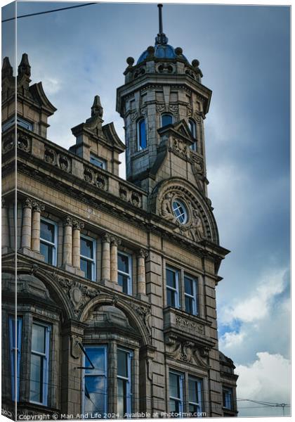 Vintage clock tower on an old European-style building against a cloudy sky in Leeds, UK. Canvas Print by Man And Life