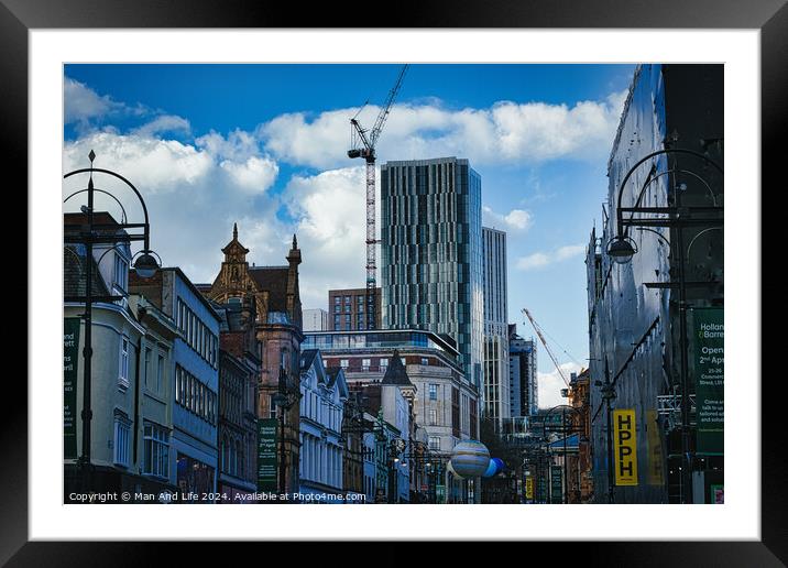 Urban cityscape with historic buildings and modern skyscraper under construction against a blue sky with clouds in Leeds, UK. Framed Mounted Print by Man And Life
