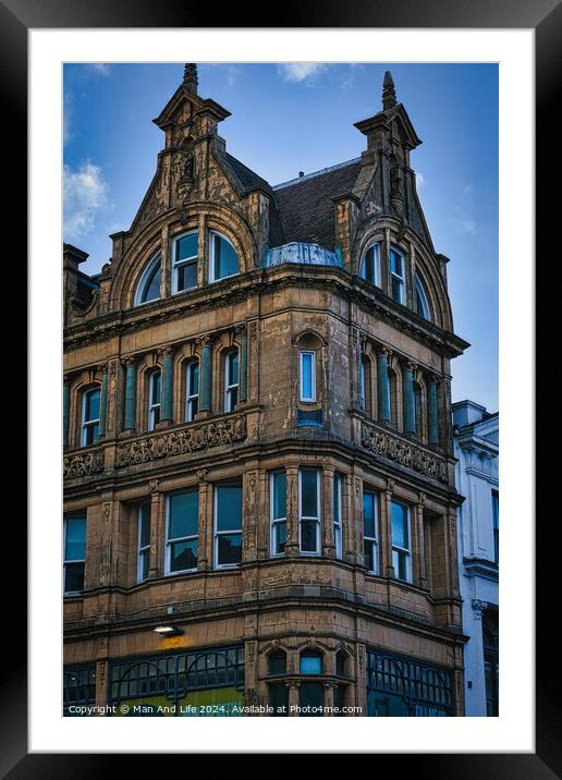 Victorian architecture with ornate details on a historic building's facade against a blue sky in Leeds, UK. Framed Mounted Print by Man And Life