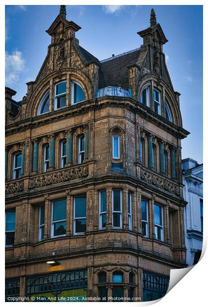 Victorian architecture with ornate details on a historic building's facade against a blue sky in Leeds, UK. Print by Man And Life