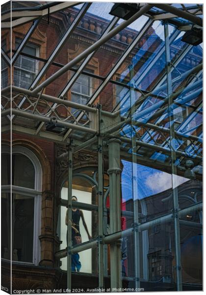 Urban contrast with old brick building and modern glass structure, reflecting city life and architectural diversity in Leeds, UK. Canvas Print by Man And Life