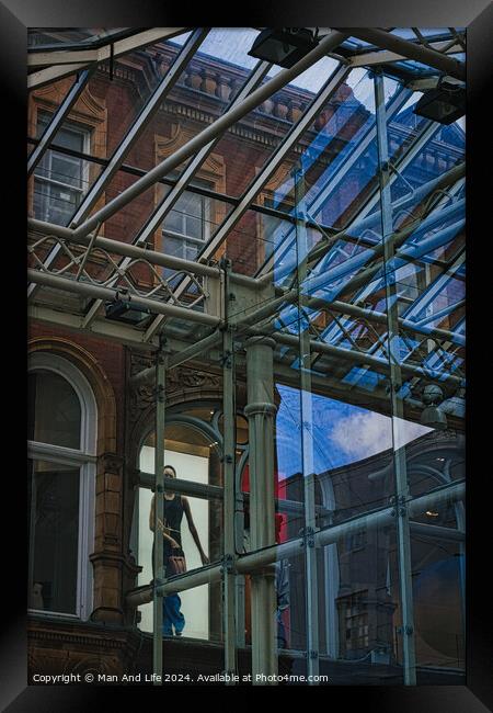Urban contrast with old brick building and modern glass structure, reflecting city life and architectural diversity in Leeds, UK. Framed Print by Man And Life