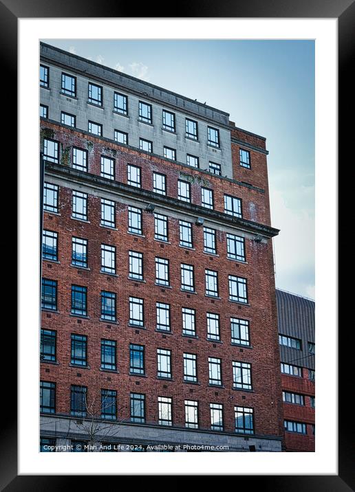 Facade of a modern red brick building against a clear blue sky, showcasing urban architecture in Leeds, UK. Framed Mounted Print by Man And Life