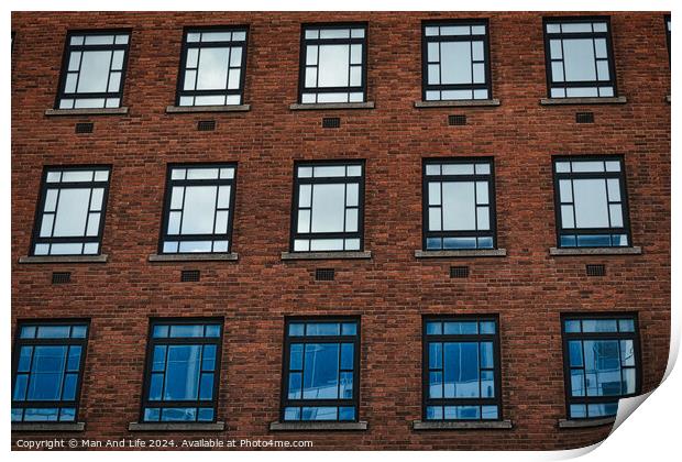 Facade of a brick building with symmetrical windows reflecting the sky in Leeds, UK. Print by Man And Life