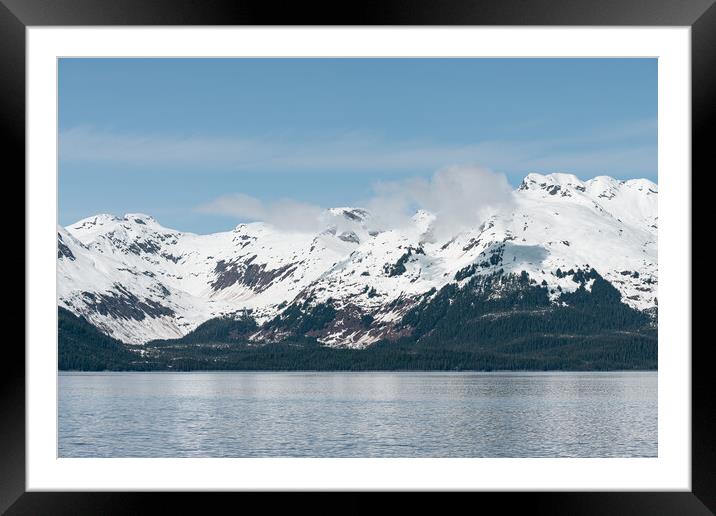 Sun and shadows on a snow covered mountain with clouds and mist, Alaska, USA Framed Mounted Print by Dave Collins