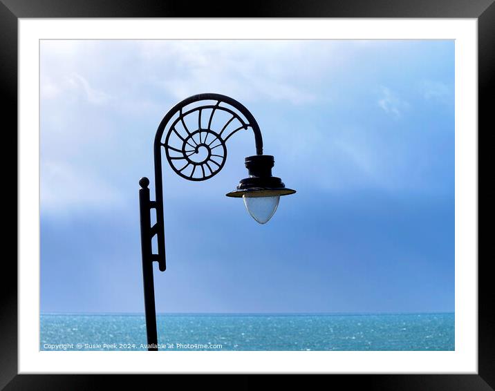 Nautilus-design Lamp against Stormy Ocean Blues  Framed Mounted Print by Susie Peek